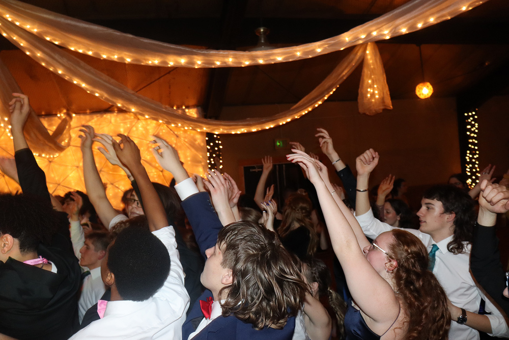Students dance in a group at the semi-formal dance at the Hayloft. 
