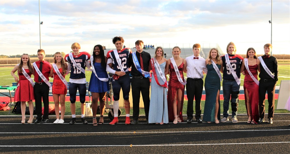 The entire 2022 Homecoming court of Heritage stands on the track at the Heritage football  stadium after the king and queen were announced. 