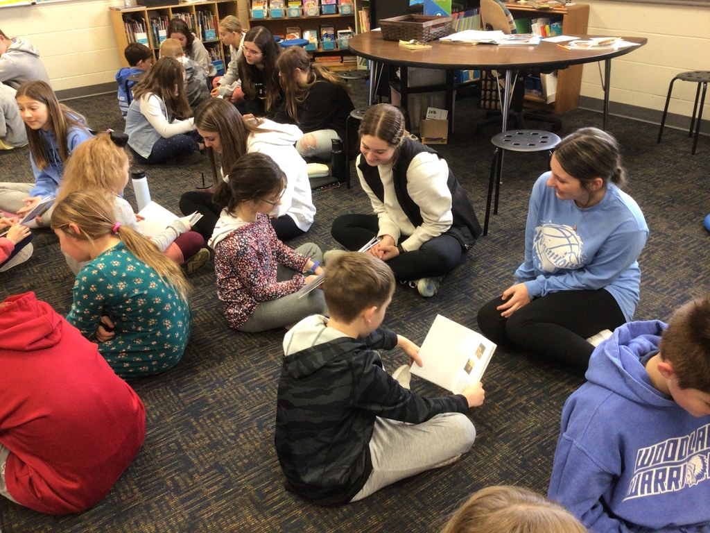 Third grade presenting Young Author books to tenth grade.